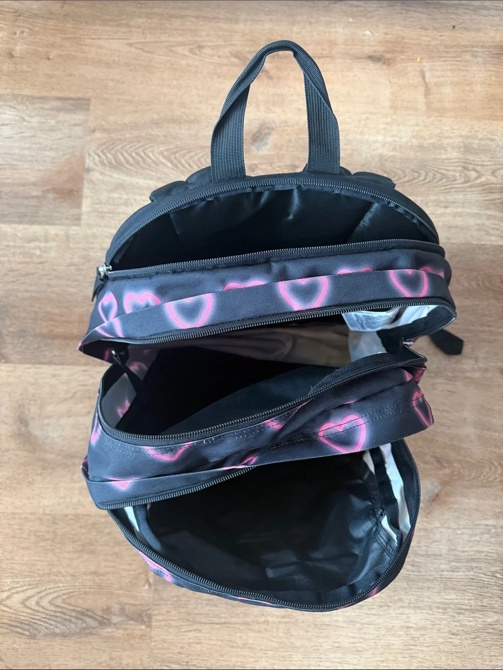 Jansport Black Backpack with Pink Heart Pattern